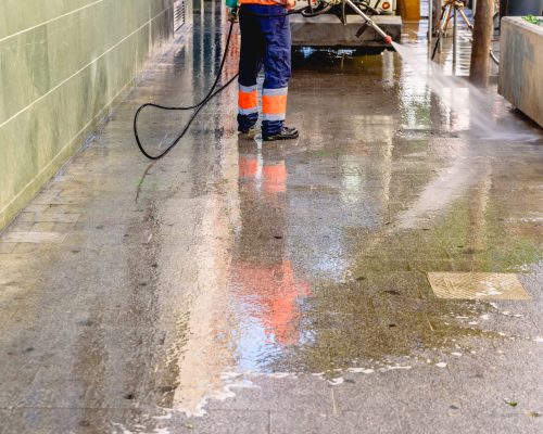 cleaning-worker-throwing-pressure-water-to-clean-t-2026-03-26-04-02-16-utc